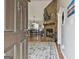 Open-concept living room, showcasing a stone fireplace, hardwood floors, and dining area at 100 Rockland Trl, Sharpsburg, GA 30277