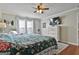 Inviting main bedroom with a plush bed, white dresser, and neutral decor at 100 Rockland Trl, Sharpsburg, GA 30277