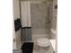 Bathroom with shower/tub, marble-look shower tile, stylish shower curtain, and modern finishes at 349 Saratoga Pl, Riverdale, GA 30296