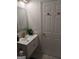 Bathroom features a modern vanity with marble countertop and gold fixtures at 349 Saratoga Pl, Riverdale, GA 30296