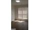 Sunlit bedroom with new flooring, fresh paint, and large window at 349 Saratoga Pl, Riverdale, GA 30296