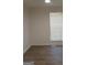Bright bedroom with light wood-look floors and natural light from the window at 349 Saratoga Pl, Riverdale, GA 30296