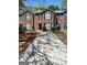 Attractive brick townhomes with well-maintained landscaping and a long driveway at 349 Saratoga Pl, Riverdale, GA 30296