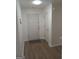 Bright hallway featuring new flooring, fresh paint, and access to multiple rooms at 349 Saratoga Pl, Riverdale, GA 30296
