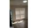 Bright kitchen area with new flooring, a large window, and stainless steel refrigerator at 349 Saratoga Pl, Riverdale, GA 30296
