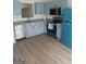 Beautiful kitchen with stainless steel appliances, modern cabinets, and new flooring at 349 Saratoga Pl, Riverdale, GA 30296