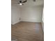 Bright living room with ceiling fan and light wood-look floors, ready for customization at 349 Saratoga Pl, Riverdale, GA 30296