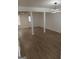 Spacious living room with new flooring, fresh paint, and modern lighting fixtures at 349 Saratoga Pl, Riverdale, GA 30296