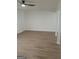 Bright living room with ceiling fan and light wood-look floors provides neutral space to customize at 349 Saratoga Pl, Riverdale, GA 30296