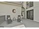 Spacious back deck with comfortable seating area and moon decor at 225 Mapledale Trl, Sharpsburg, GA 30277