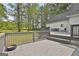 Multi-level gray back deck provides ample room for outdoor activities at 225 Mapledale Trl, Sharpsburg, GA 30277