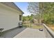 The back deck offers views of the fenced yard and surrounding trees at 225 Mapledale Trl, Sharpsburg, GA 30277