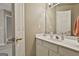 Well-lit bathroom features a large mirror, vanity, and ample storage at 225 Mapledale Trl, Sharpsburg, GA 30277