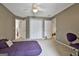 This bedroom provides good closet space, carpet, and ceiling fan at 225 Mapledale Trl, Sharpsburg, GA 30277