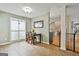Dining area with a small wooden table and chairs, neutral paint and tile flooring, and lots of natural light at 225 Mapledale Trl, Sharpsburg, GA 30277