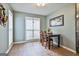 Dining room with tile floor, natural light and a small wooden table with wooden chairs at 225 Mapledale Trl, Sharpsburg, GA 30277