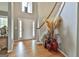 Grand foyer with hardwood flooring, a staircase, and decor offering a welcoming entrance at 225 Mapledale Trl, Sharpsburg, GA 30277