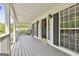 Inviting covered front porch with stylish decor and black shutters, offering a relaxing outdoor space at 225 Mapledale Trl, Sharpsburg, GA 30277
