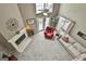 Spacious living room with fireplace, ceiling fan, and access to a private deck at 225 Mapledale Trl, Sharpsburg, GA 30277