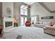 Spacious living room featuring a fireplace, neutral carpet, high ceilings and natural light from the many windows at 225 Mapledale Trl, Sharpsburg, GA 30277