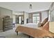 Spacious main bedroom with views into a sitting room and ensuite bathroom at 225 Mapledale Trl, Sharpsburg, GA 30277