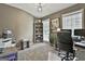 Office with gray walls, carpet flooring, built in shelving, and two windows providing natural light at 225 Mapledale Trl, Sharpsburg, GA 30277