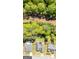 Aerial view showing a property's boundary, landscaping, and neighborhood at 11970 Fairway Overlook, Fayetteville, GA 30215