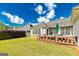 Home featuring a backyard with a patio and wooded area at 11970 Fairway Overlook, Fayetteville, GA 30215