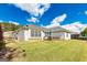 Home featuring a large backyard with an outdoor patio and wood fence at 11970 Fairway Overlook, Fayetteville, GA 30215