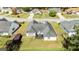 Aerial view of a backyard deck with outdoor seating and landscaped lawn at 11970 Fairway Overlook, Fayetteville, GA 30215