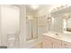 Well-lit bathroom with a glass-enclosed shower and vanity at 11970 Fairway Overlook, Fayetteville, GA 30215