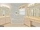 Bright bathroom featuring a corner tub, double vanities and bright natural light at 11970 Fairway Overlook, Fayetteville, GA 30215