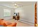 Bright bedroom with a sofa and desk at 11970 Fairway Overlook, Fayetteville, GA 30215
