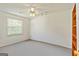 Empty bedroom with bright natural light and carpeted floor at 11970 Fairway Overlook, Fayetteville, GA 30215