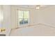 Bright, carpeted bedroom with a large window and natural light at 11970 Fairway Overlook, Fayetteville, GA 30215
