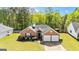 Charming brick home featuring a well-manicured lawn and a two-car garage at 11970 Fairway Overlook, Fayetteville, GA 30215
