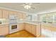 Open kitchen area featuring stainless steel appliances and wood floors at 11970 Fairway Overlook, Fayetteville, GA 30215