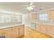 Bright kitchen with lots of counter space, hardwood floors and stainless steel dishwasher at 11970 Fairway Overlook, Fayetteville, GA 30215