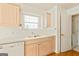 Bright, modern kitchen with stainless dishwasher, wooden floors and plenty of storage at 11970 Fairway Overlook, Fayetteville, GA 30215