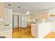 Kitchen featuring wood floors, stainless steel appliances and lots of cabinet space at 11970 Fairway Overlook, Fayetteville, GA 30215