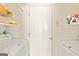 Neat and organized laundry room at 11970 Fairway Overlook, Fayetteville, GA 30215