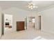 Spacious primary bedroom leading to en-suite bathroom and fireplace at 11970 Fairway Overlook, Fayetteville, GA 30215