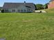 Expansive backyard featuring a lush green lawn and ample space for entertaining and recreation at 35 Charleston Ln, Covington, GA 30016