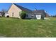 Exterior view of the backyard with a large grassy area at 35 Charleston Ln, Covington, GA 30016
