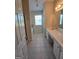 Bathroom with double vanity, tiled floors and a shower over the tub at 35 Charleston Ln, Covington, GA 30016