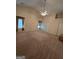Spacious bedroom featuring a ceiling fan, neutral walls, and carpet flooring at 35 Charleston Ln, Covington, GA 30016
