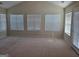 Bright bedroom with multiple windows and neutral carpet at 35 Charleston Ln, Covington, GA 30016