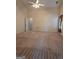 A bright bedroom featuring carpet, neutral paint and a ceiling fan at 35 Charleston Ln, Covington, GA 30016