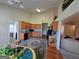 Bright eat-in kitchen with hardwood floors, and views into the living space at 35 Charleston Ln, Covington, GA 30016