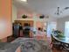 Open-concept eat-in kitchen with stainless appliances and access to the living room at 35 Charleston Ln, Covington, GA 30016